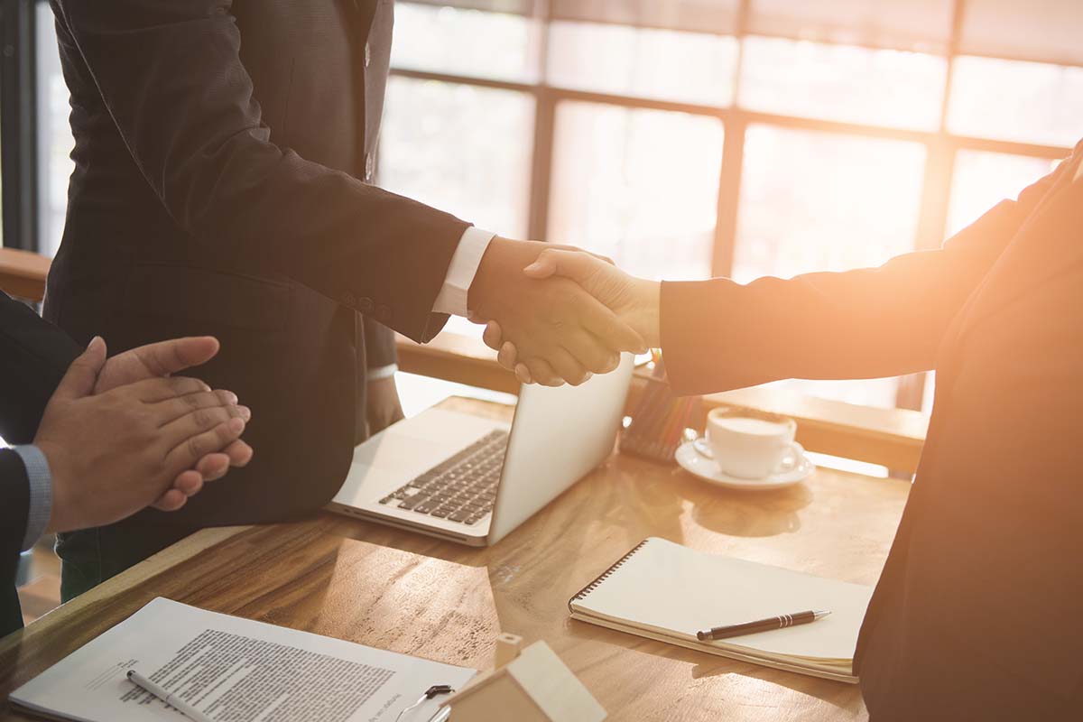 realtor and client handshaking. real estate agent shaking hands with customer. sale & purchase property with signing contract document and approved mortgage loan